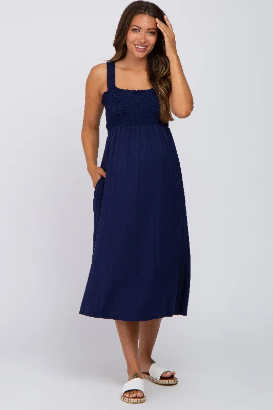 Maternity dress for a baby's first visit to the meditation garden Navy Smocked Ruffle Strap Maternity Midi Dress Maternity dress for a baby's first visit to the meditation garden Navy Smocked Ruffle Strap Maternity Midi Dress